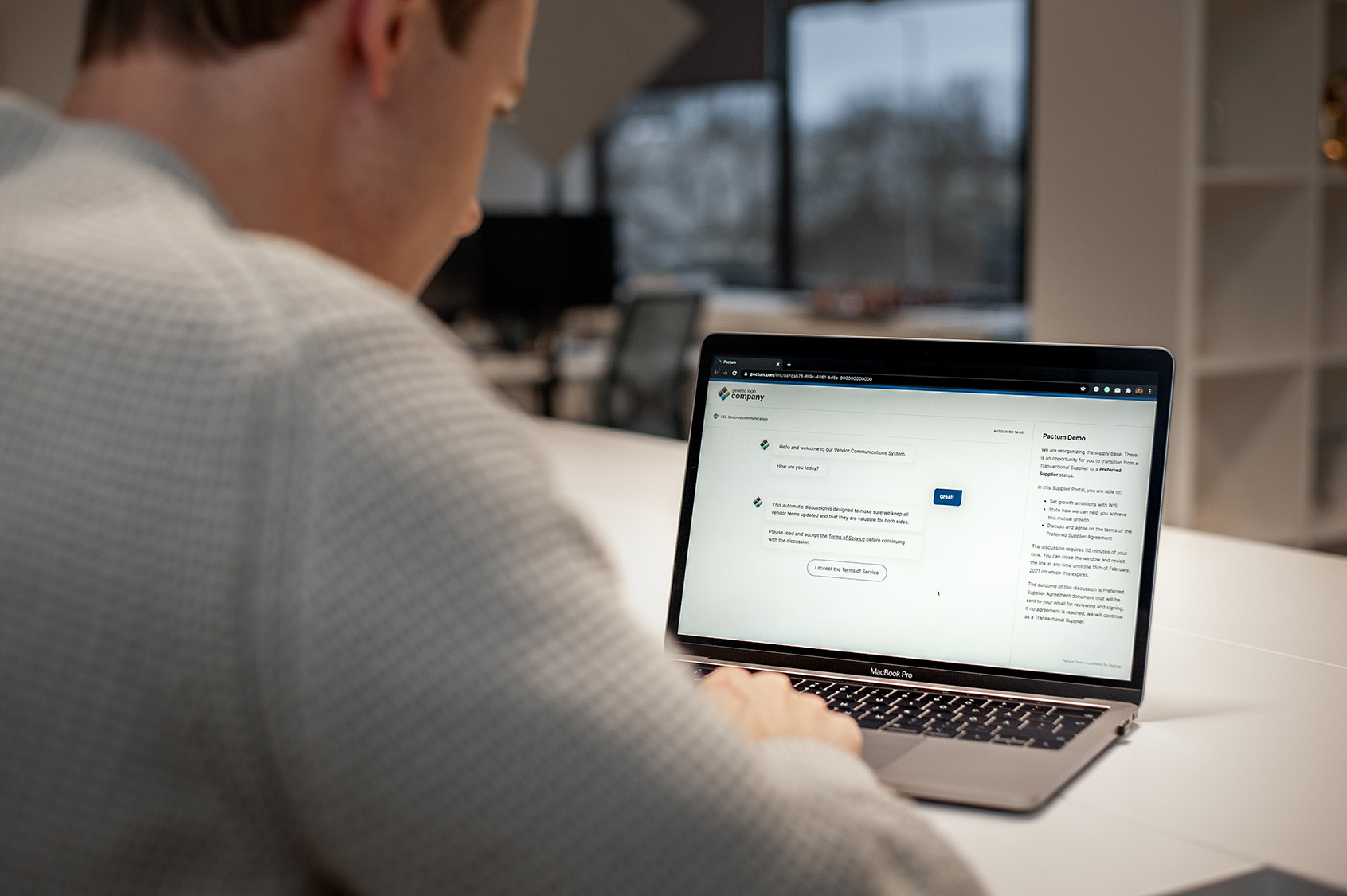 Pactum AI being demonstrated on a laptop