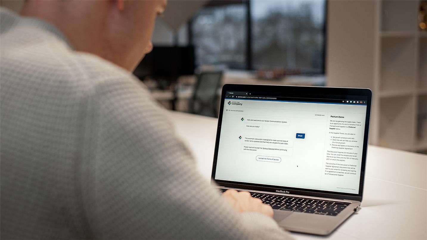 Pactum AI being demonstrated on a laptop