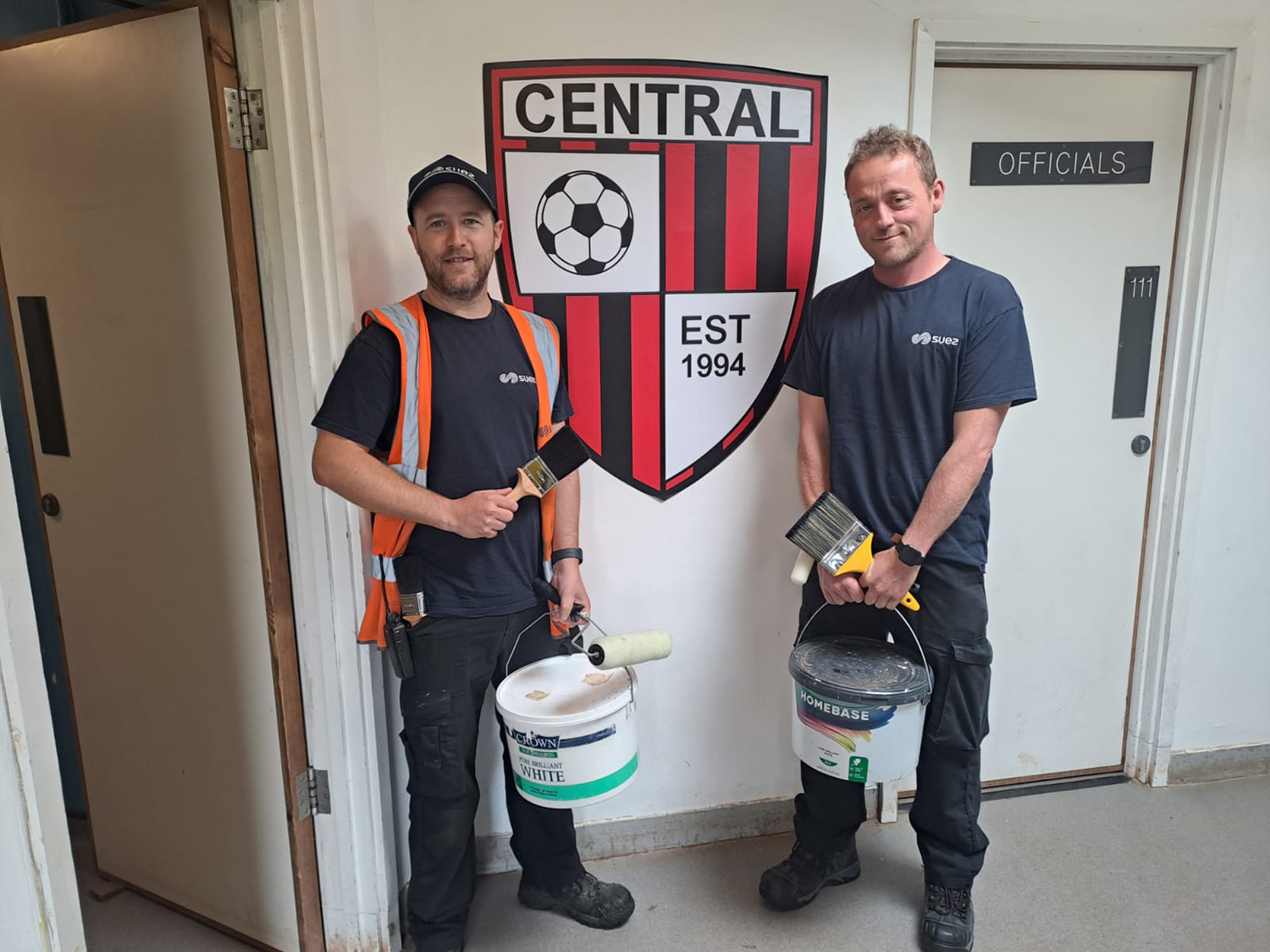 SUEZ employees help paint local football team club house