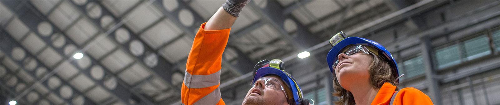 Employees looking up inside energy-from-waste facility Employees looking up inside energy-from-waste facility