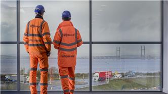 Employees looking out over the River Severn