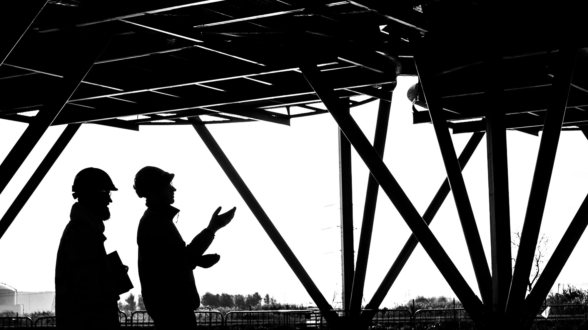 SUEZ employees on a energy-from-waste facility in silhouette