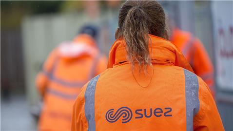 SUEZ employees at household waste recycling centre