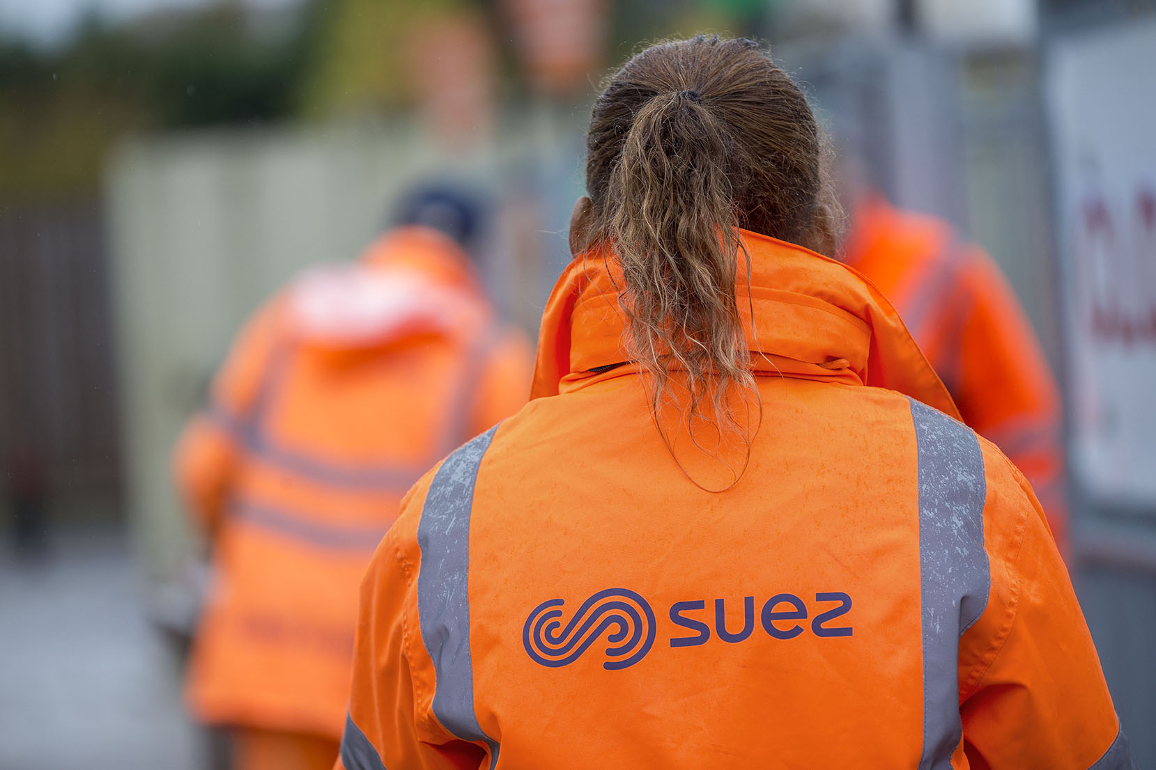 SUEZ employees at household waste recycling centre
