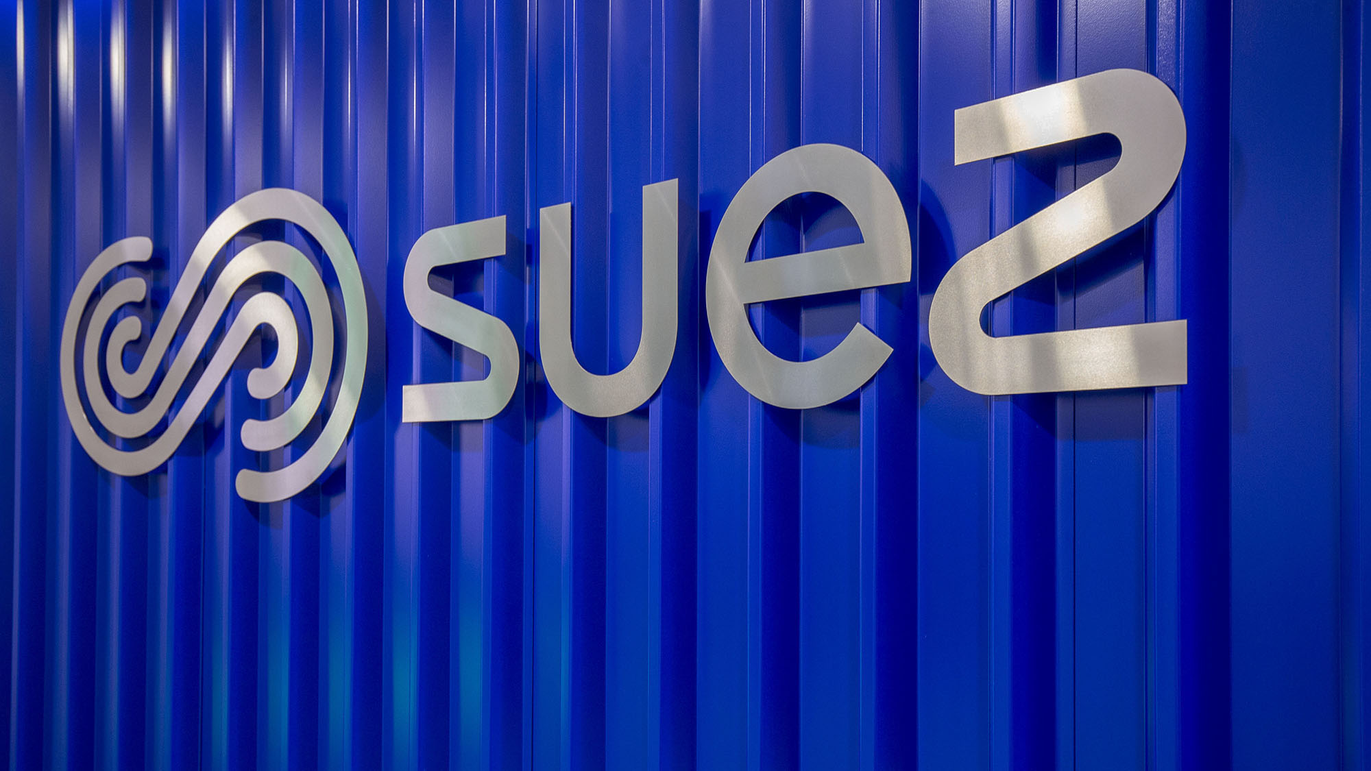SUEZ logo on wall Suez tower
