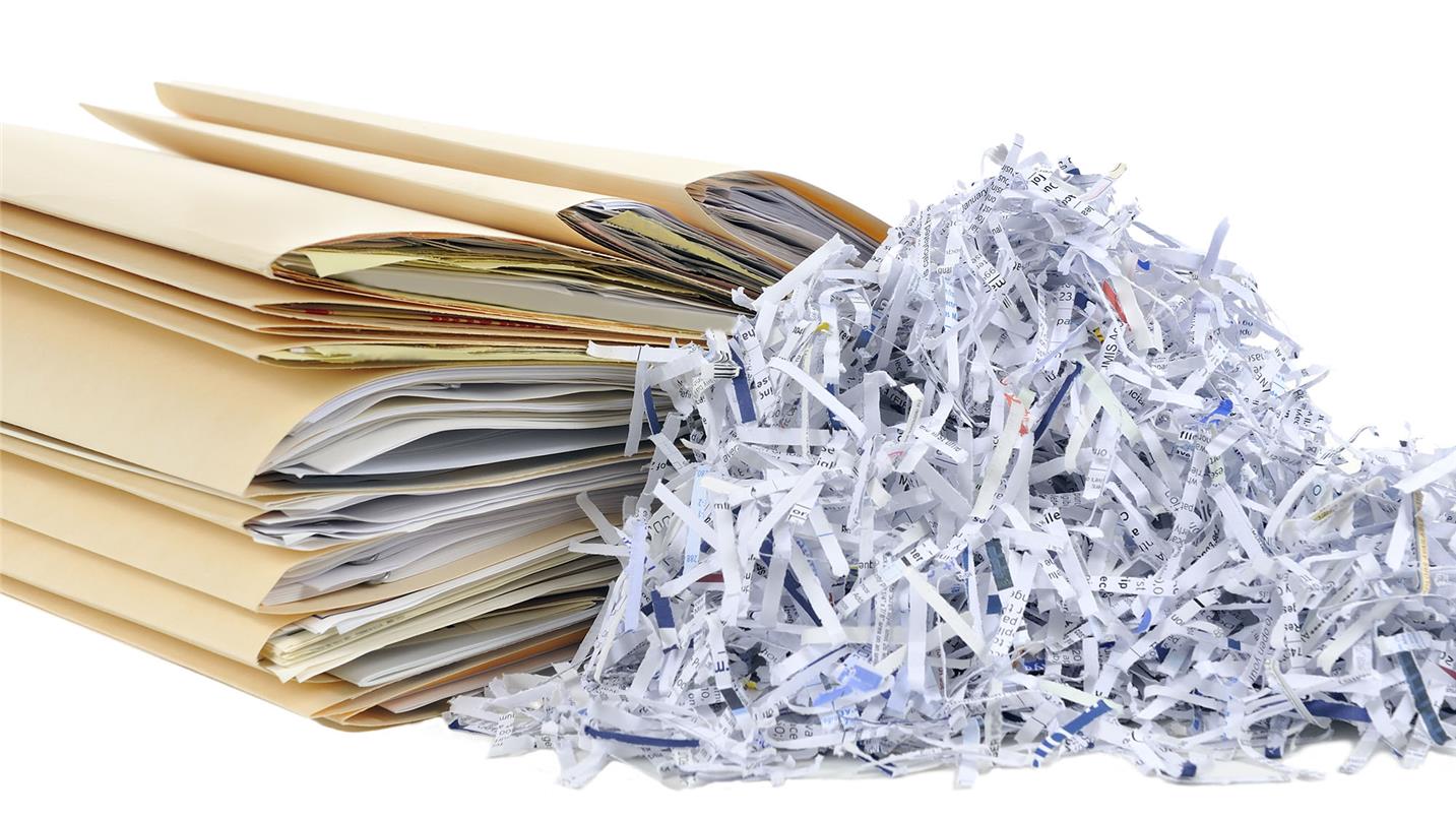 Shredded paper next to paper files
