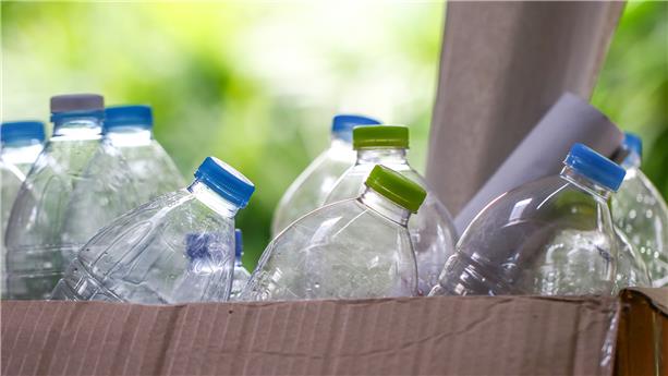 Plastic bottles in a cardboard box