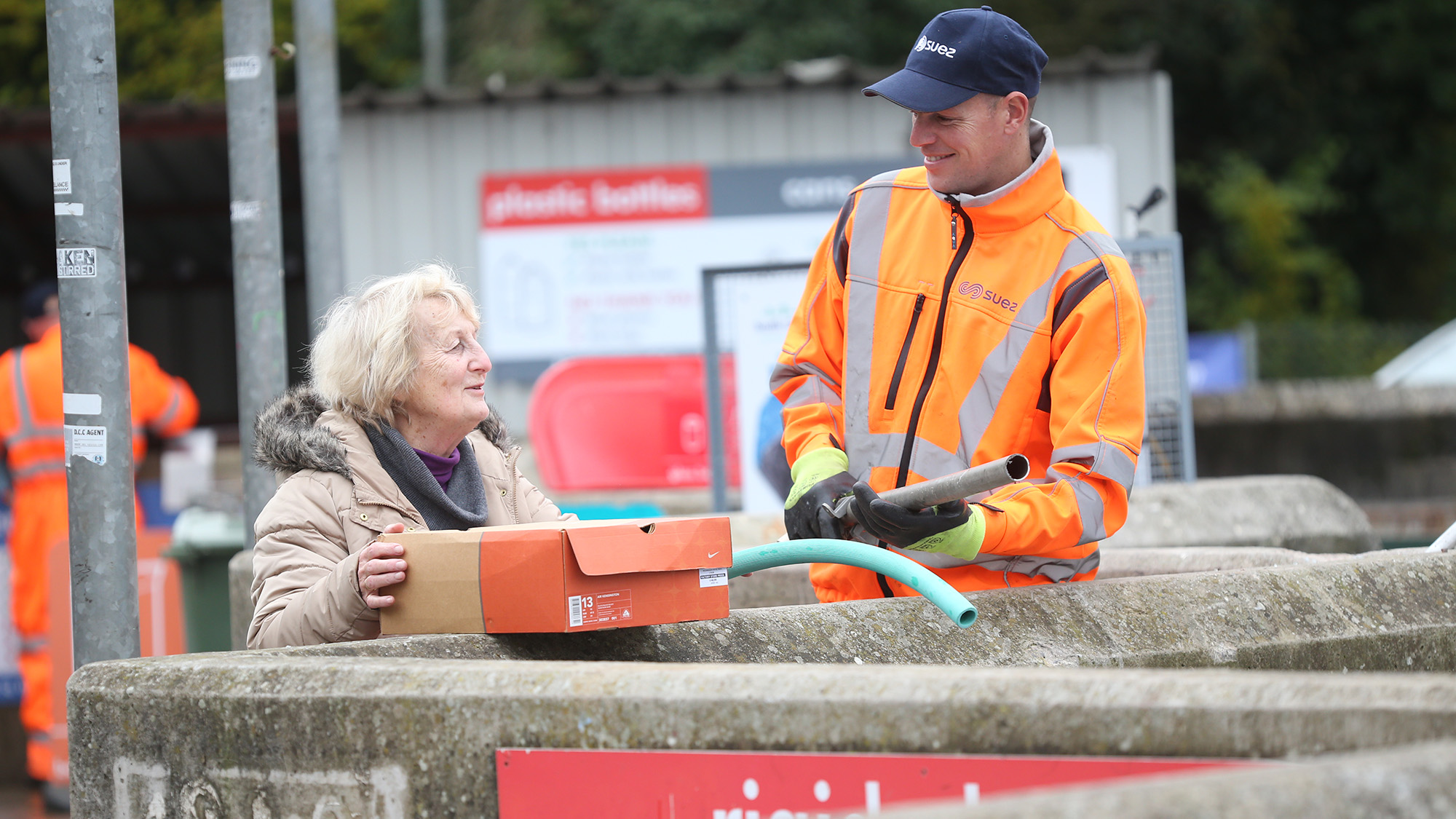 Employee helping member of public at Thornbury