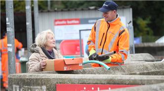 Employee helping member of public at Thornbury
