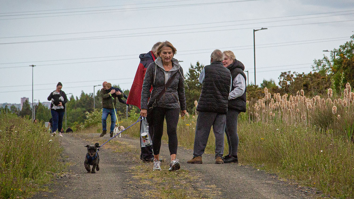 Residents walking on the nature trail at Path Head