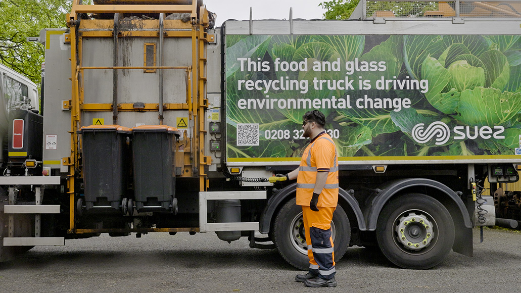 Truck collecting food and glass waste